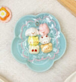 Six connected mini rabbit head squeezables Squishy. Food- Grade Silicone. Perfect Size for Bag Chain