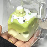 PeachyPuff tiny octopus on top of the Macha cheesecake squishy
