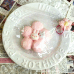 PeachyPuff Rabbit on top of pink flower Squishy